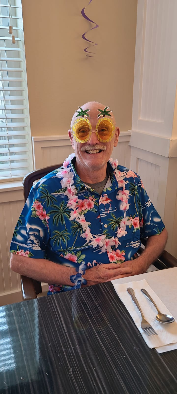 elderly man wearing fun sunglasses at heartwood place